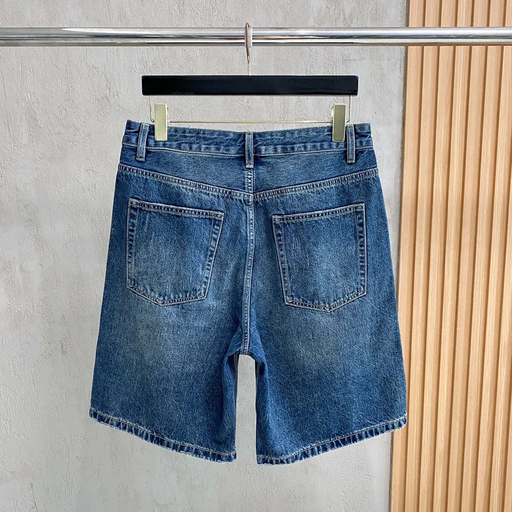 Side angle showing relaxed silhouette and branded hardware accents