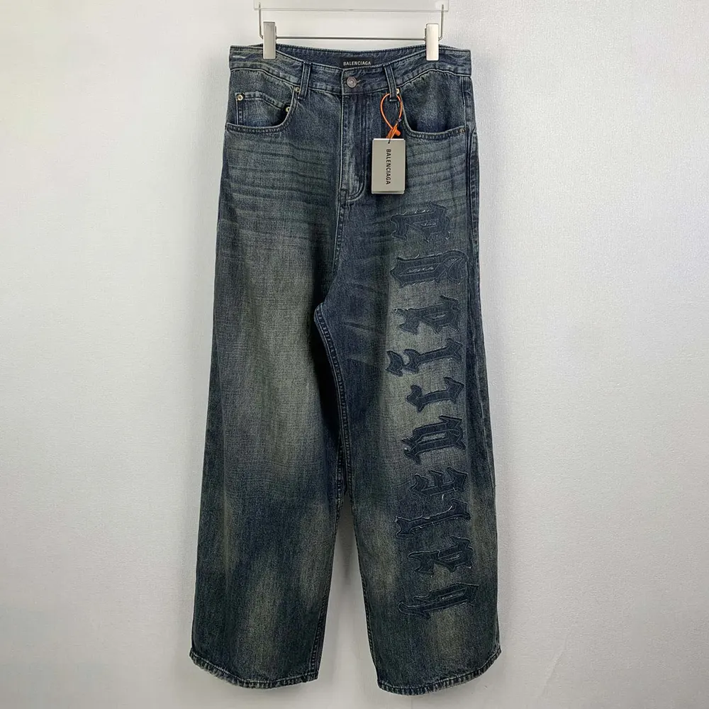 Close-up detail of denim texture and stitching on Balenciaga Women Minimal Baggy Pants