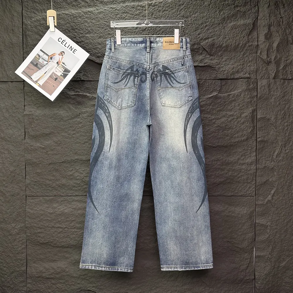 Side profile showing wide leg silhouette of Balenciaga blue pants