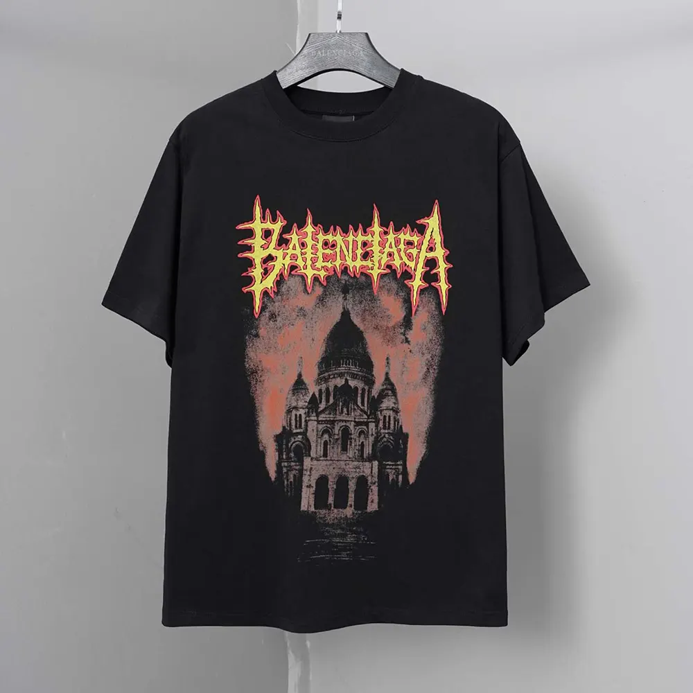 Close-up detail of embossed Balenciaga logo on black oversized t-shirt