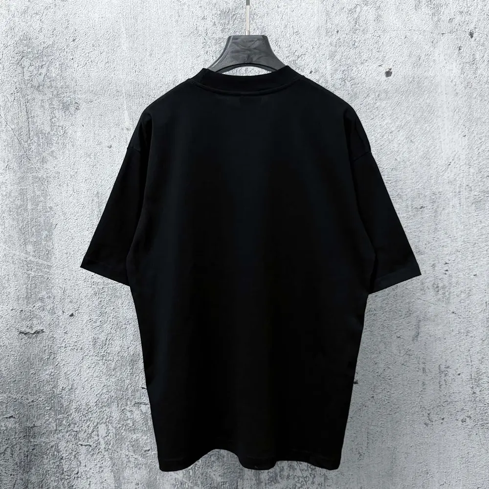 Side profile showing oversized fit of Balenciaga Men The Door Oversized T-Shirt