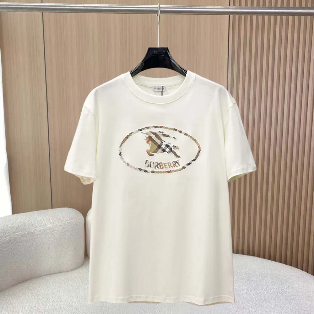 Close-up on Burberry Check Knight stamp detail on white cotton T-shirt