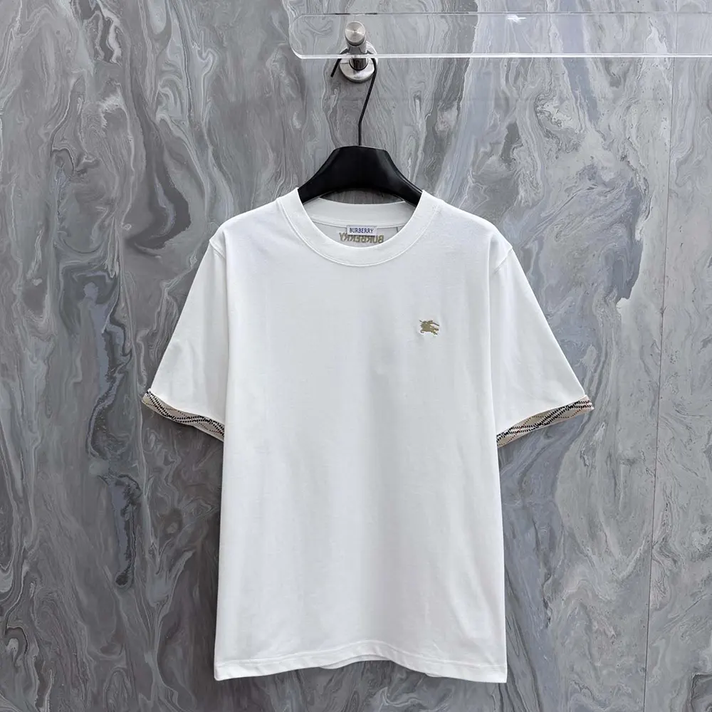 Close-up of Burberry check trim on sleeve of white cotton T-shirt