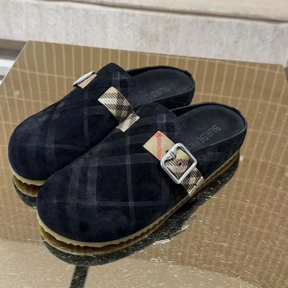 Close-up of Burberry check fabric and navy denim on Urchin Clogs