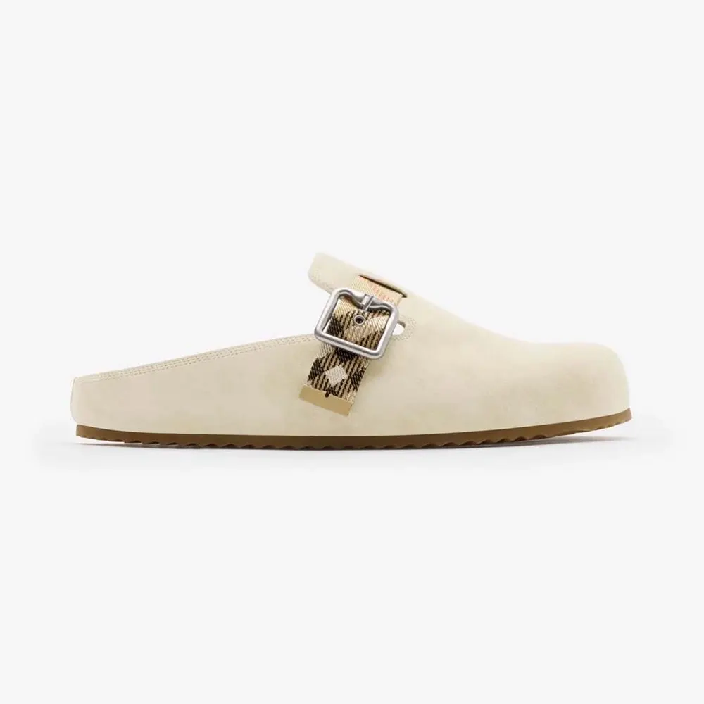 Side angle of Burberry Unisex Suede Urchin Clogs-Bake Beige showing silhouette
