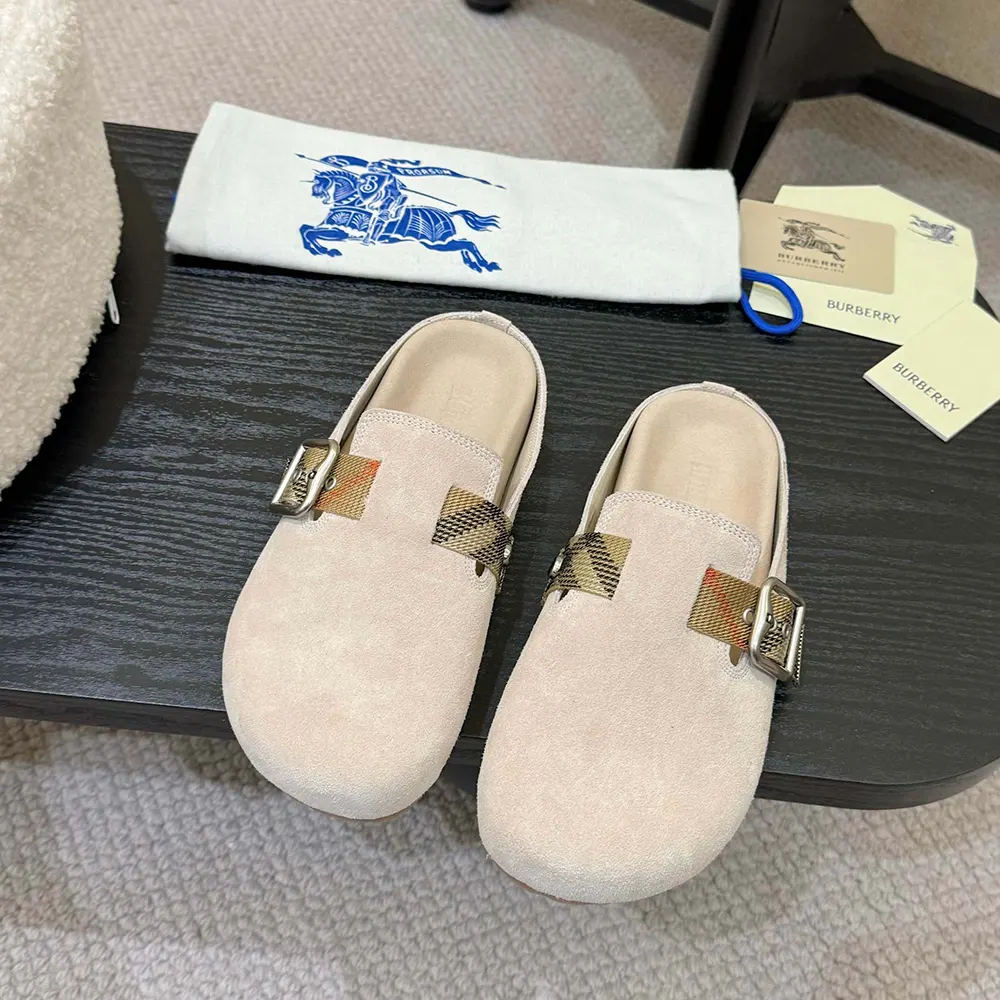 Close-up of beige suede texture on Burberry Unisex Suede Urchin Clogs