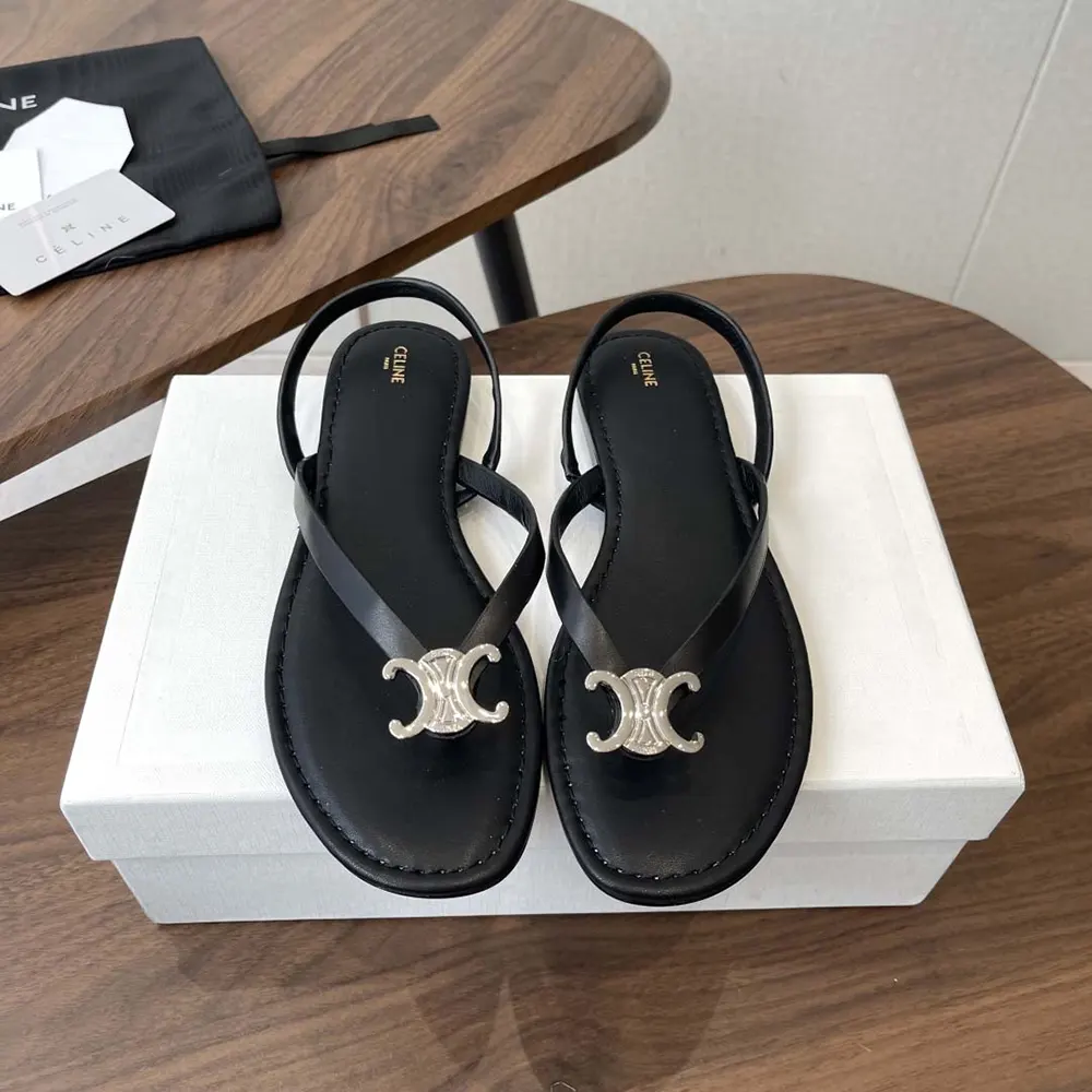 Close-up of Celine Women Biki Sandal in Calfskin-Black with signature metal logo