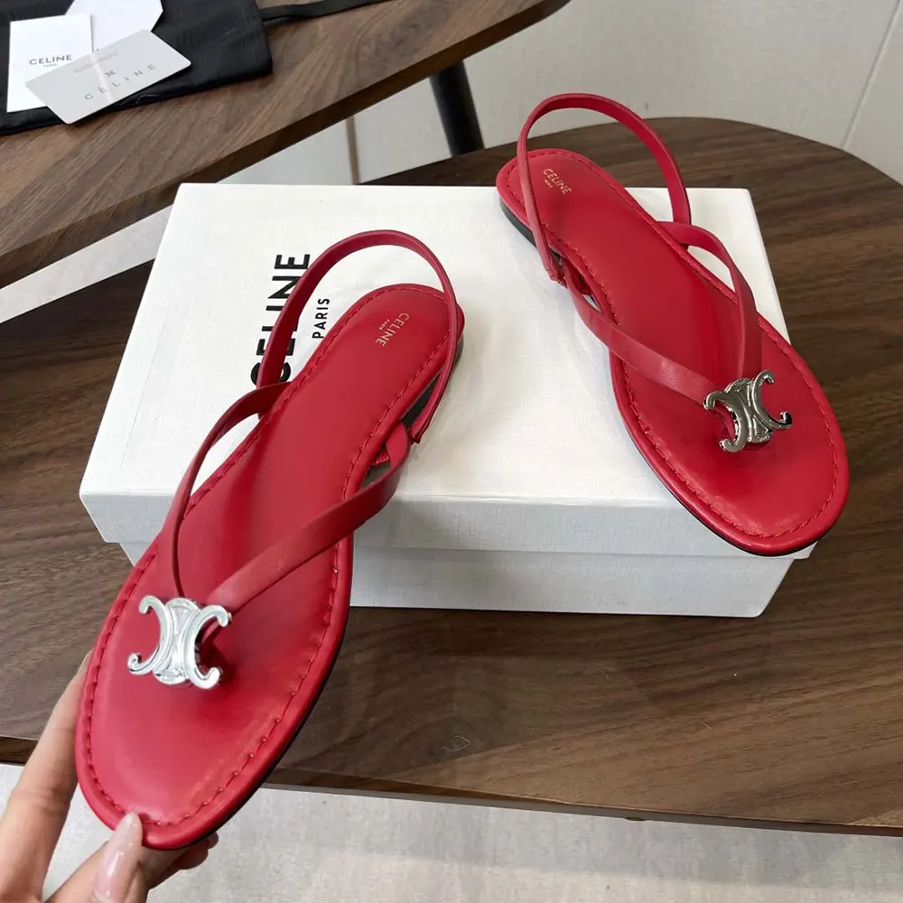 Close-up detail of red calfskin and embossed logo on Celine Women Biki Sandal