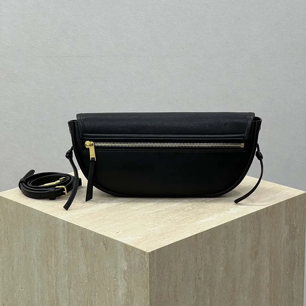 Side angle showing crescent shape of Celine Women Little Halfmoon Soft Triomphe bag
