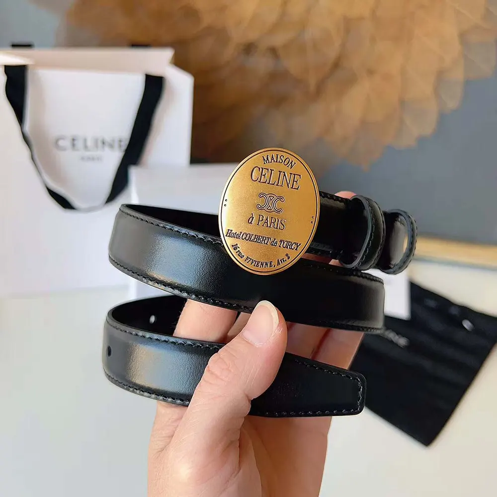 Side angle showing slim 13mm width of Celine Women Maison Celine belt in black
