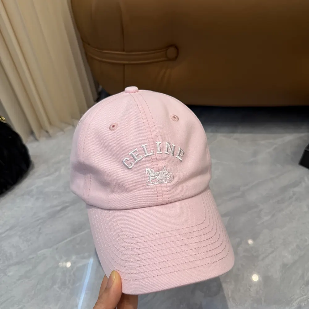 Close-up of pink cotton twill texture and embossed hardware on Celine Women Richelieu Cap