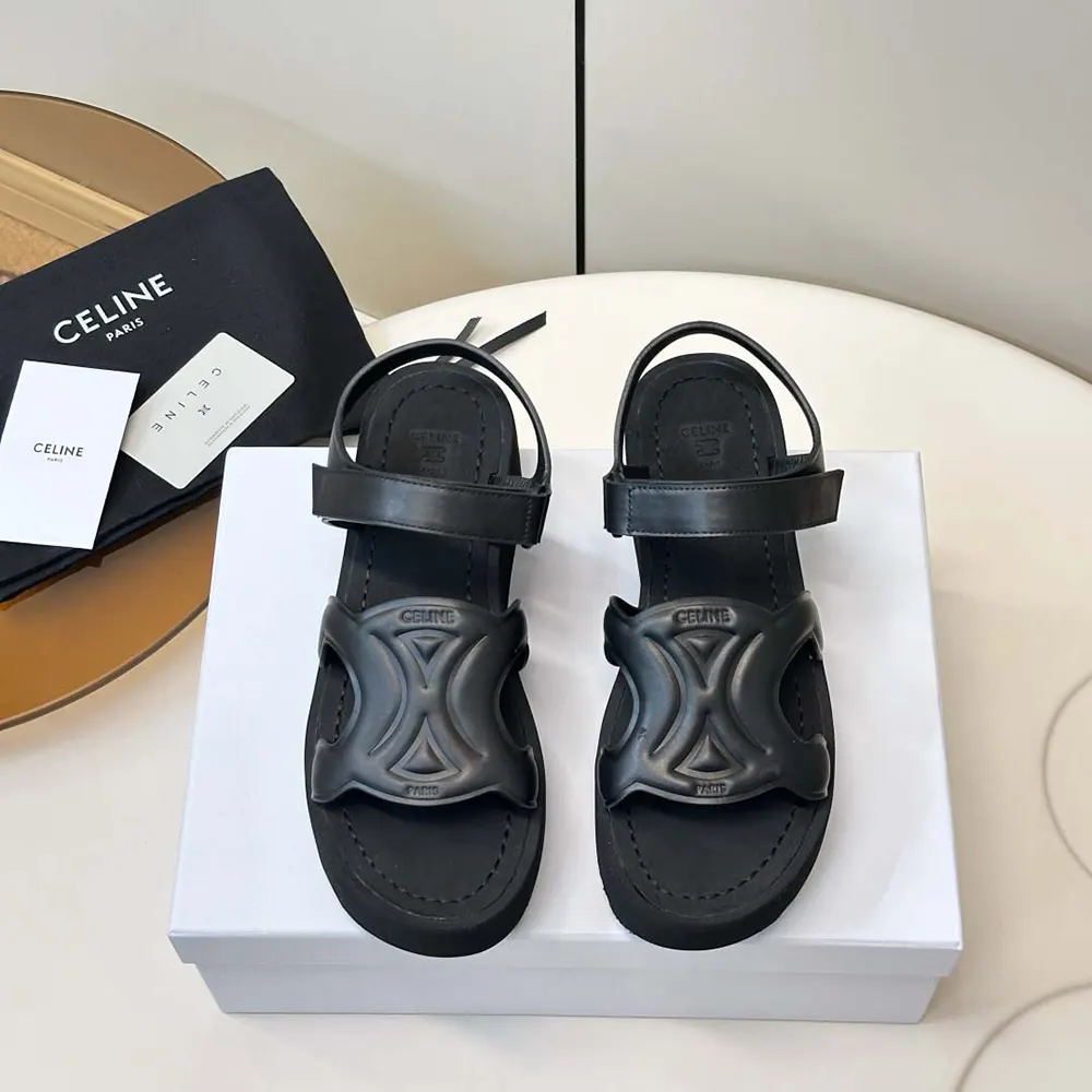 Close-up of black calfskin and embossed logo on Celine Women Sunny Sandal
