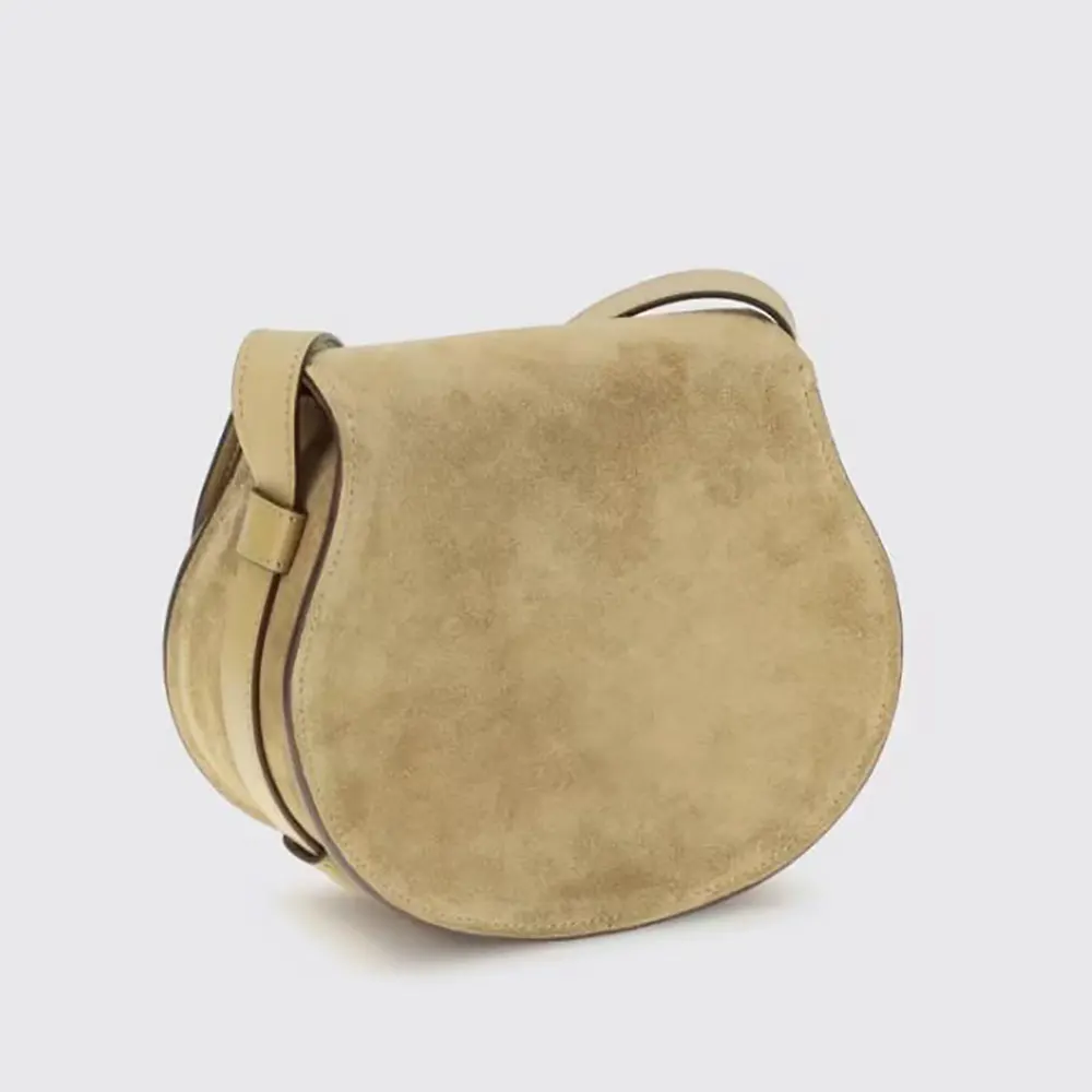 Side profile showing magnetic flap closure on Chloe Women Marcie Small Shoulder Bag