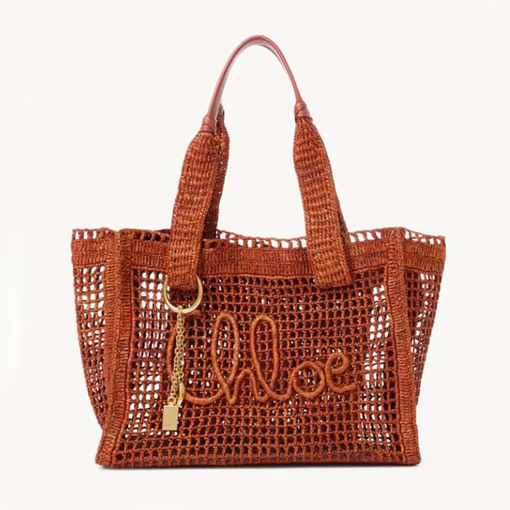 Front view of Chloe Women Summer Banana East-west Tote Bag in Raffia & Buffalo Leather