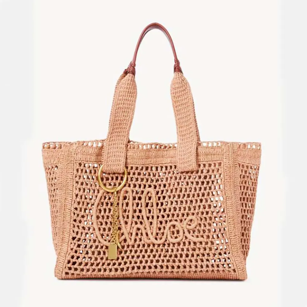Front view of Chloe Women Summer Banana East-west Tote Bag in Raffia & Buffalo Leather-Pink