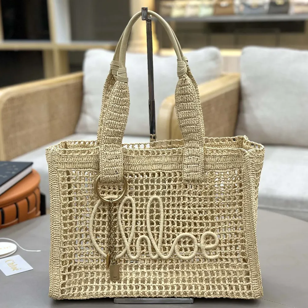 Close-up of gold-tone hardware and magnetic closure on Chloe Women Summer Banana East-west Tote Bag