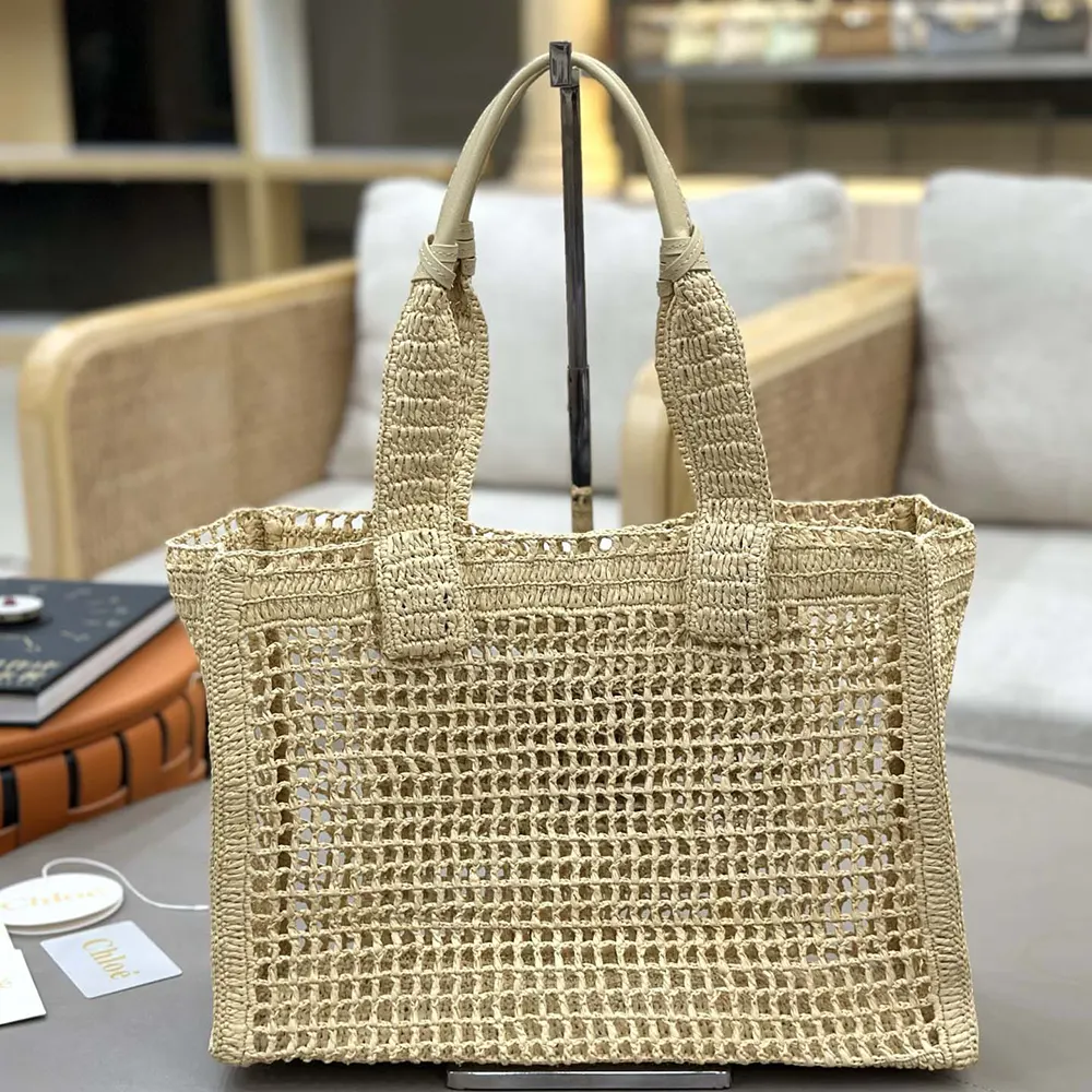 Side angle showing raffia texture and buffalo leather handles on Chloe Women Summer Banana East-west Tote Bag