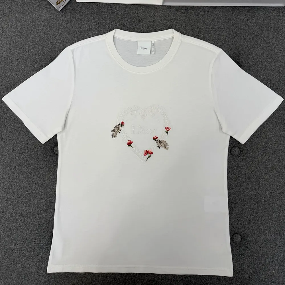 Close-up of multicolor doves and roses motif on Dior Dioramour T-Shirt