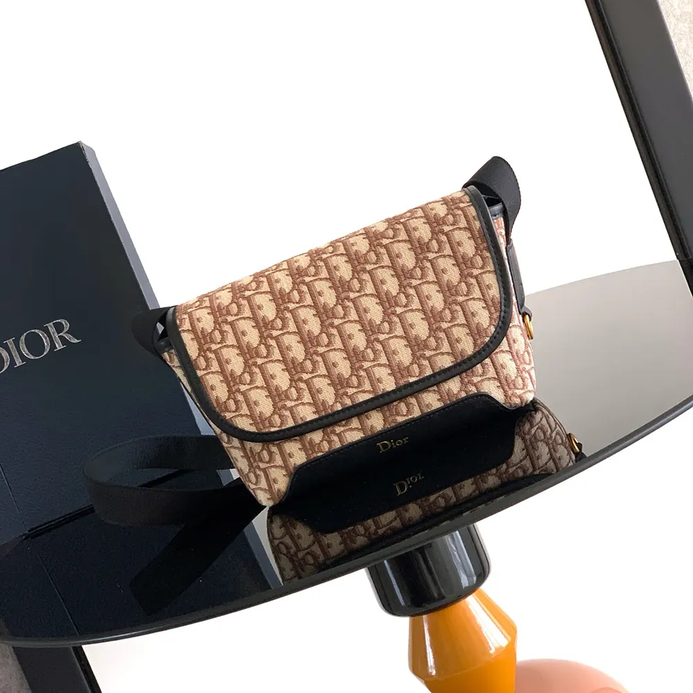 Close-up of flap and silver-tone hardware on Mini Dior Jett Messenger Bag