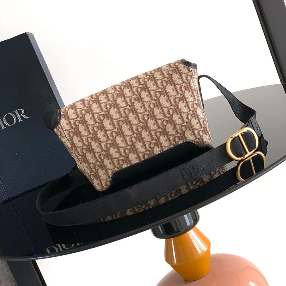 Side angle showing silhouette and adjustable strap of Mini Dior Jett Messenger Bag