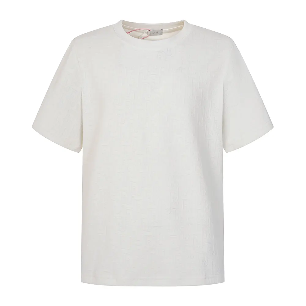 Close-up of Dior Oblique signature detail on white cotton jersey