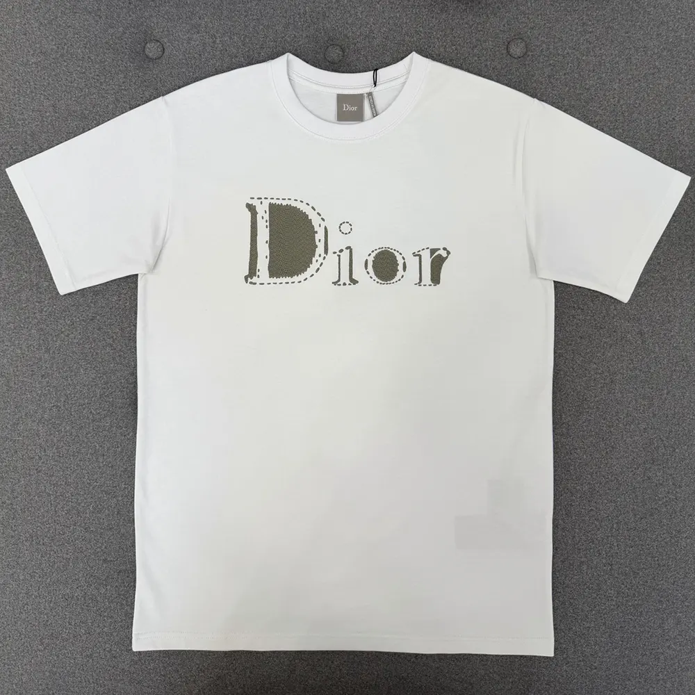 Close-up of reversed Dior logo detail on white cotton jersey T-shirt