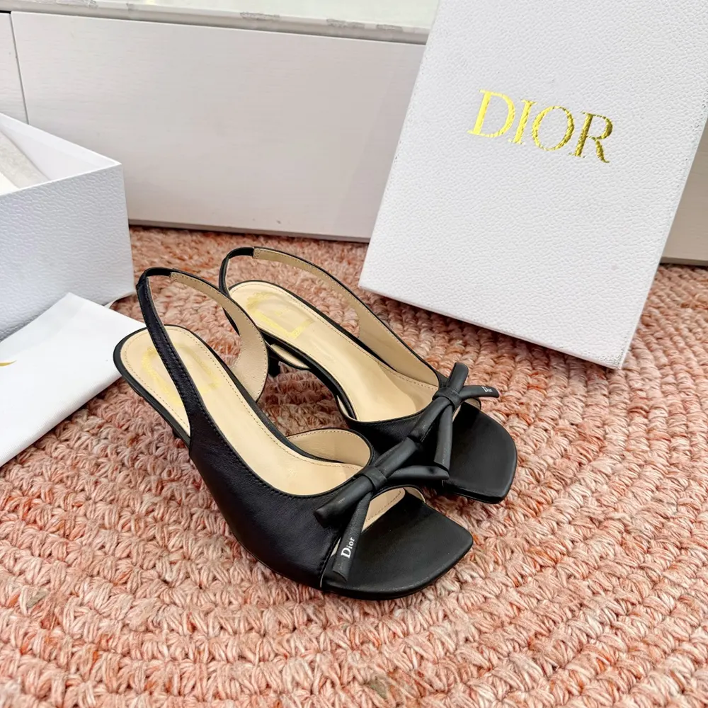 Rear angle showing slingback strap and heel on Dior Women Bow Heeled Slingback Sandal Black Lambskin