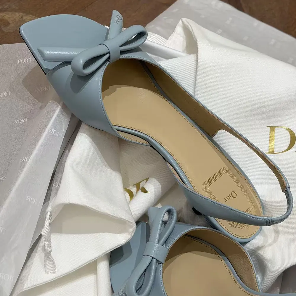Rear angle showing adjustable slingback of Dior Women Bow Heeled Slingback Sandal Bleu Ciel