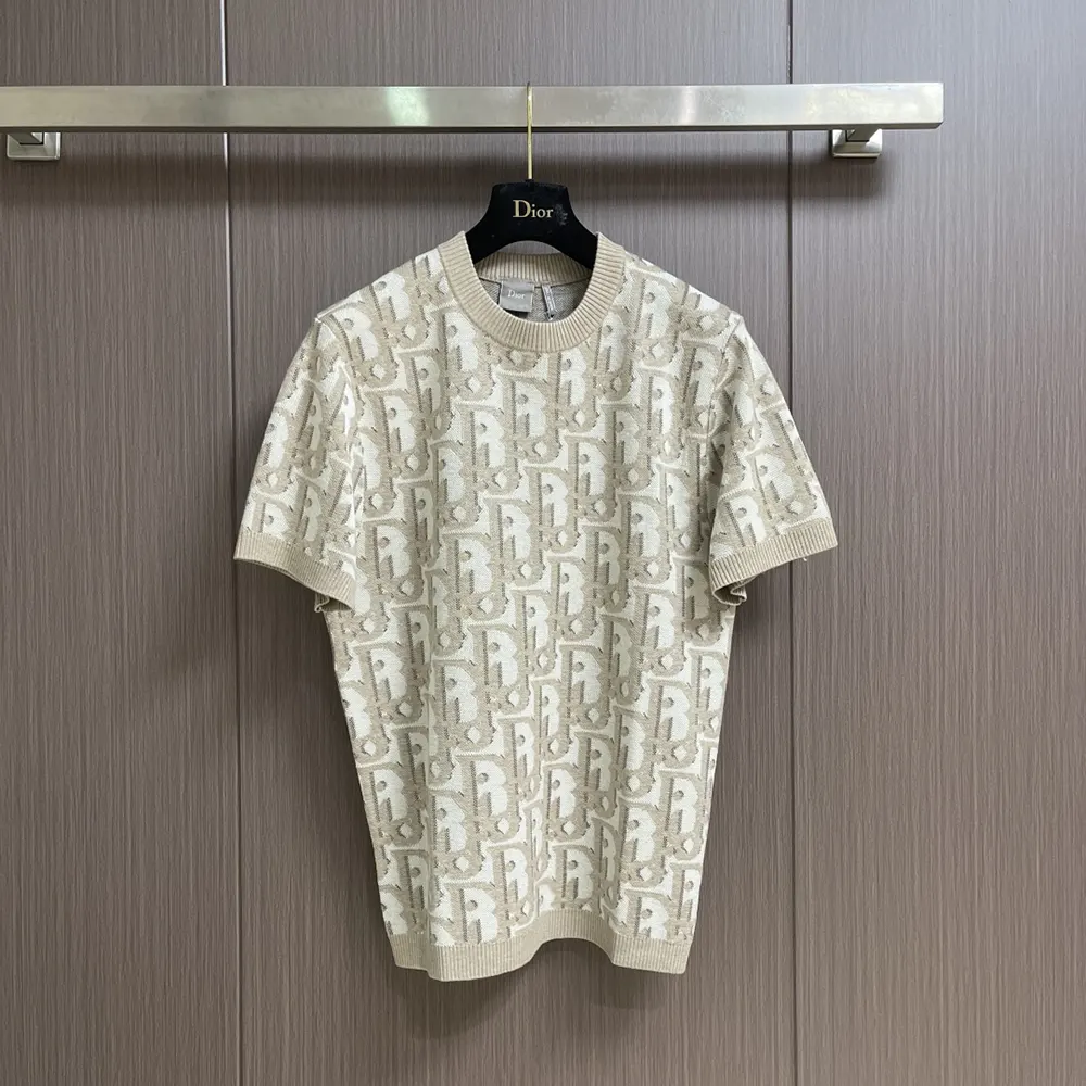 Close-up detail of Dior Oblique jacquard pattern on beige t-shirt