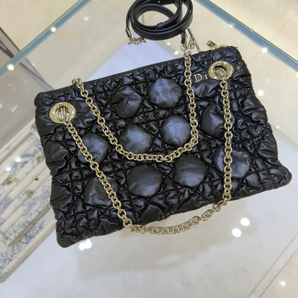 Close-up of silver-tone ‘CD’ hardware on Dior Women Small Dior Crunchy Bag