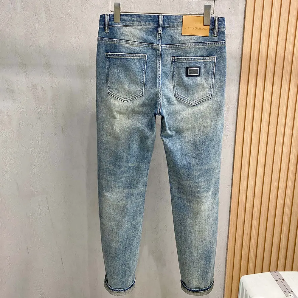 Side profile showing straight-leg cut of Dolce Gabbana D&G jeans