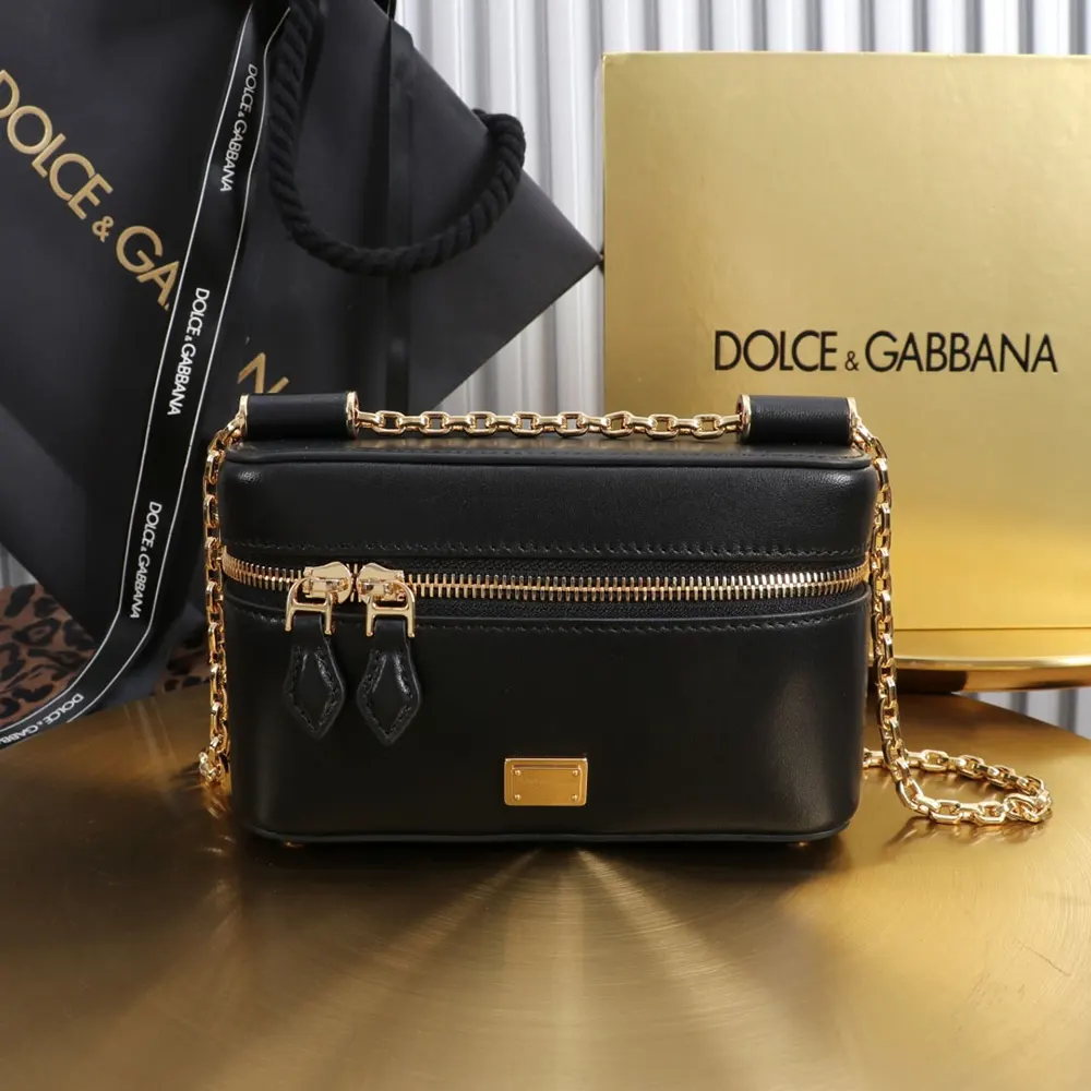 Close-up of gold-tone D&G hardware on black crossbody bag