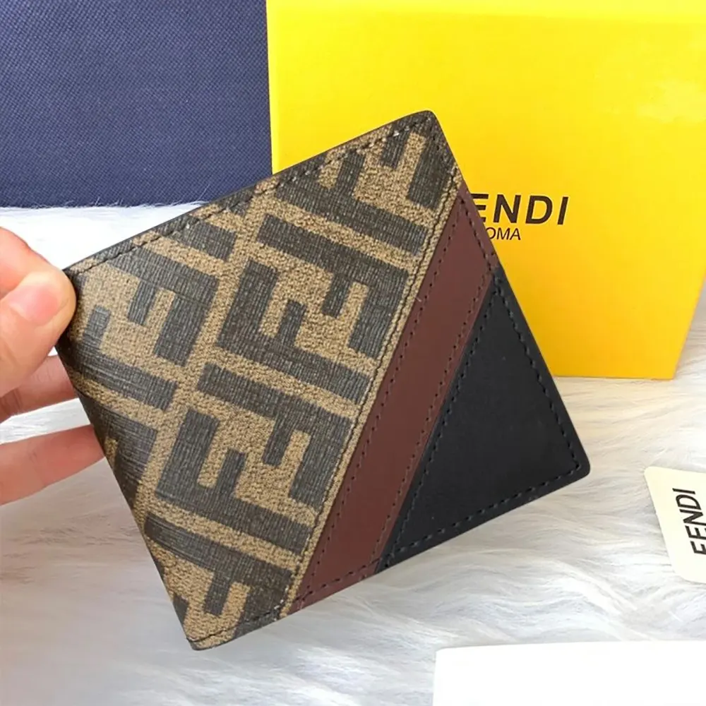 Close-up of signature FF motif and gold-tone hardware on Fendi wallet