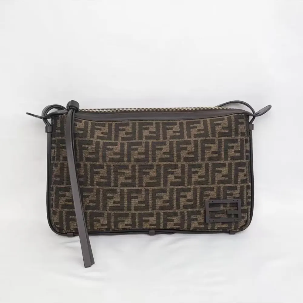 Side angle showing adjustable strap and brown leather texture