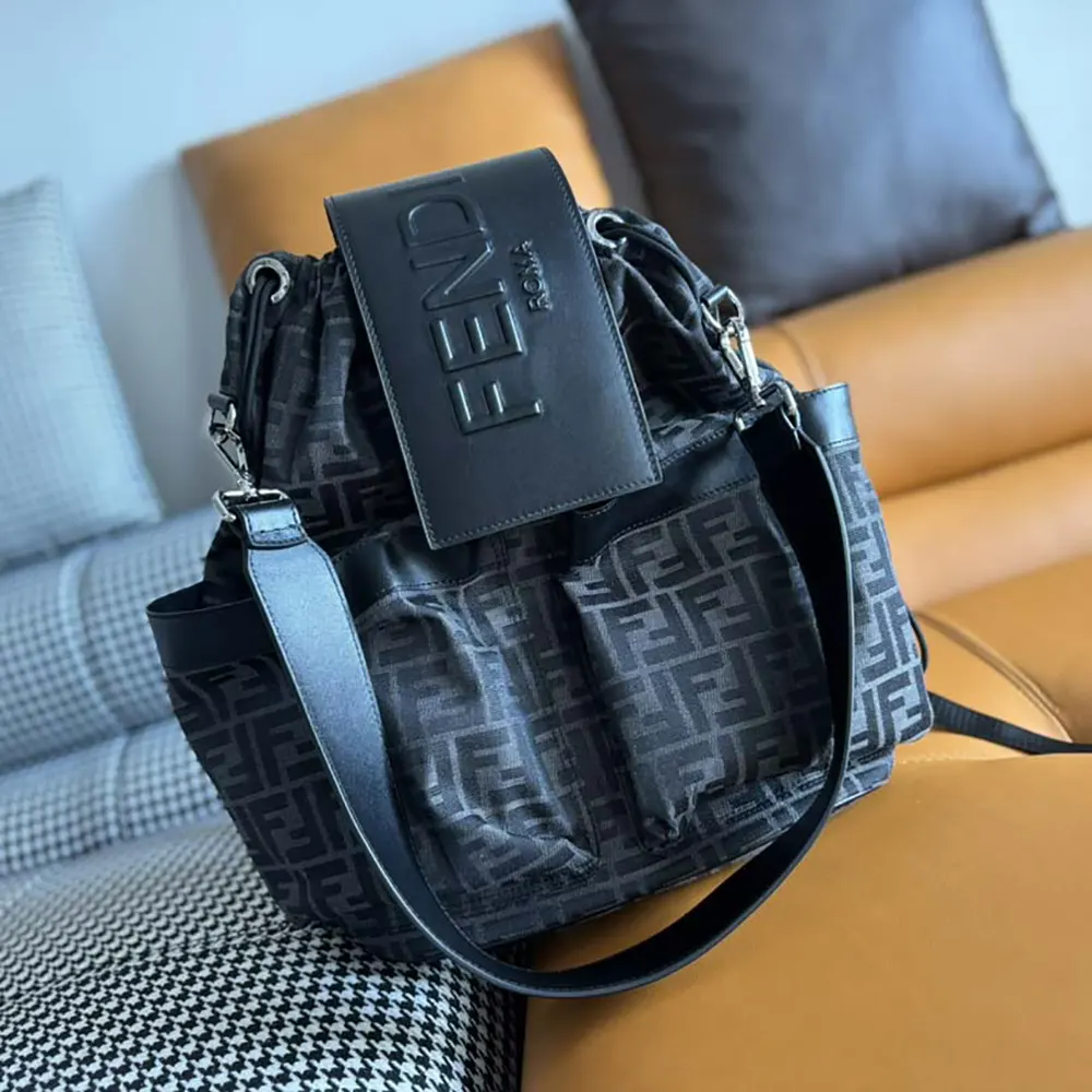 Side angle showing silver hardware on Fendi Men Strike backpack