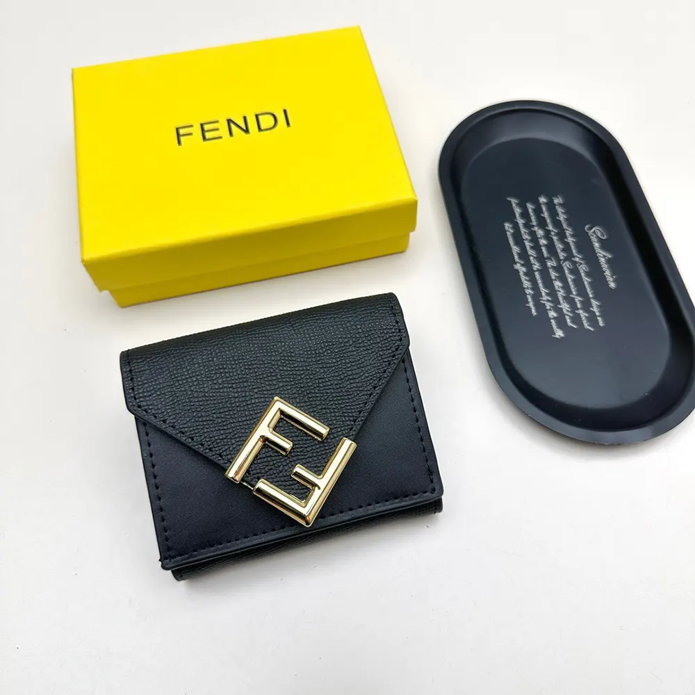 Close-up of black leather and FF diamond detail on Fendi wallet