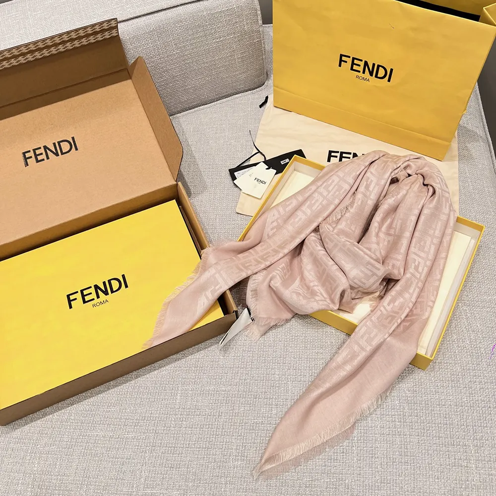 Side draped view of Fendi Unisex FF Pink Organic Silk Shawl on model