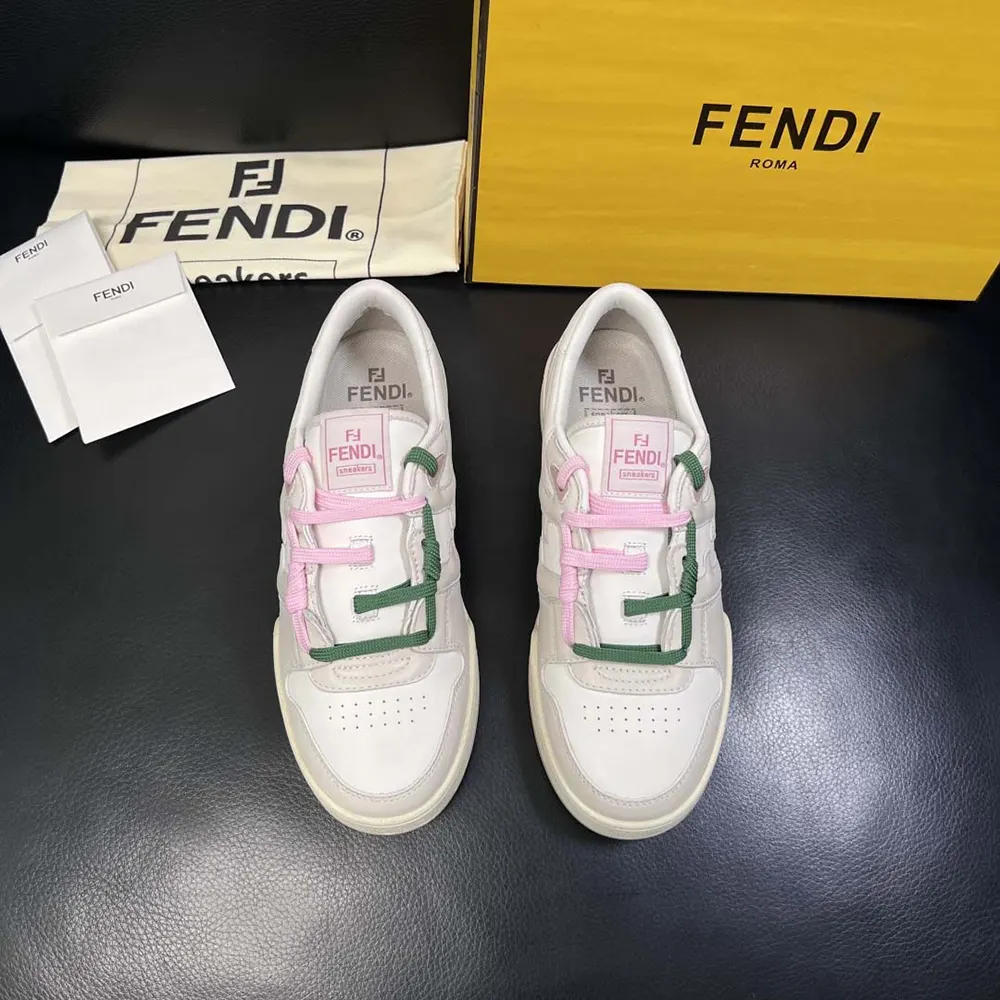 Close-up detail of Fendi embossed logo on white leather low-tops