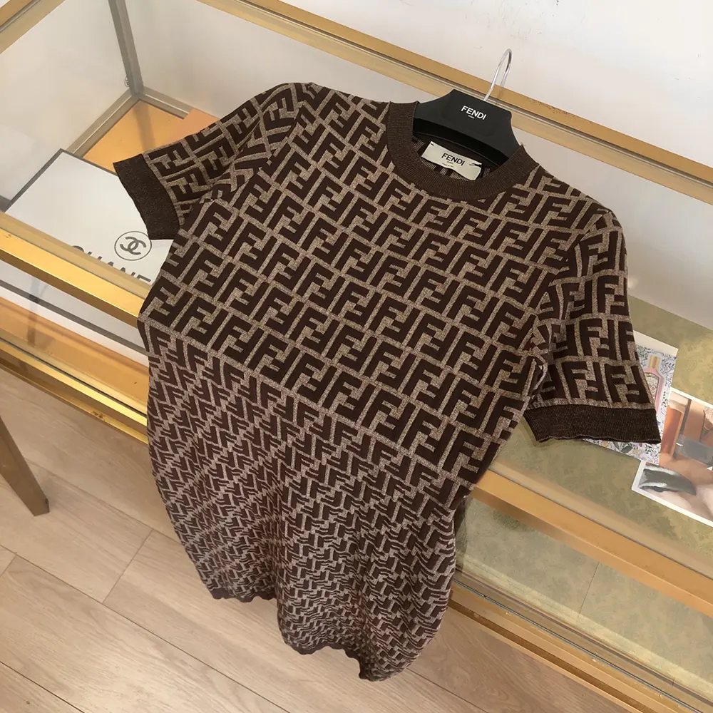 Side angle of Fendi Women Brown FF Cotton Dress highlighting relaxed silhouette