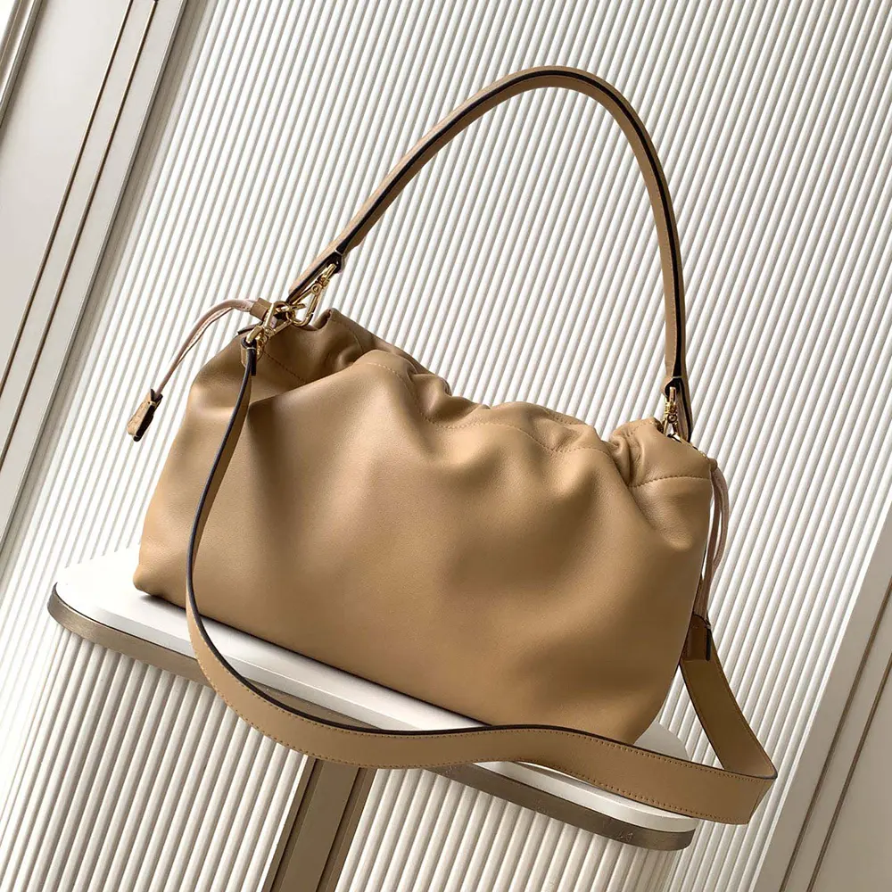 Side profile showcasing silhouette of Fendi Women Mamma Baguette Large Cappuccino Bag