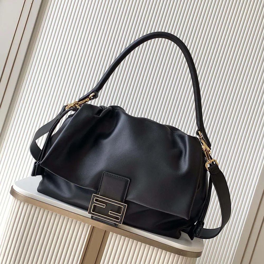 Close-up of gold hardware and flap closure on Fendi Women Mamma Baguette Bag