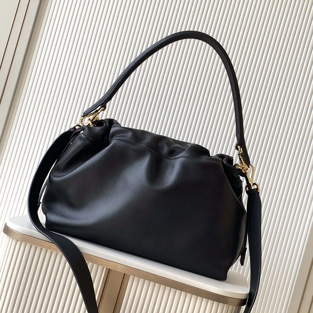 Side angle showing silhouette and leather texture of Fendi Women Mamma Baguette Bag