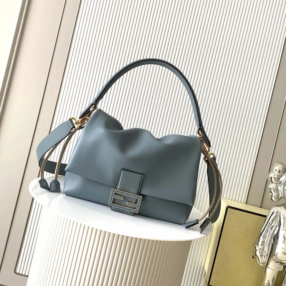 Close-up of gold-tone hardware on Fendi Women Mamma Baguette Medium Mercury Blue