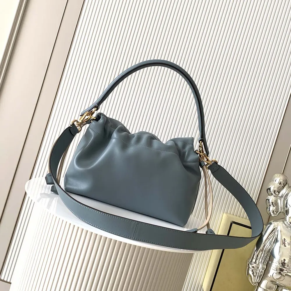 Side profile highlighting texture of Fendi Women Mamma Baguette Medium Mercury Blue bag
