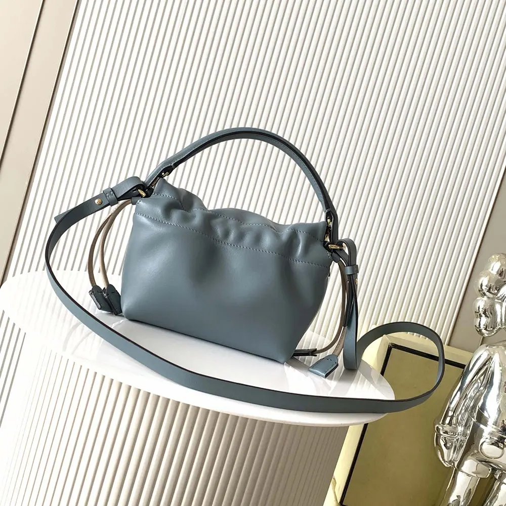 Side angle showing silhouette of Fendi Women Mamma Baguette Small Mercury Blue Mini-bag