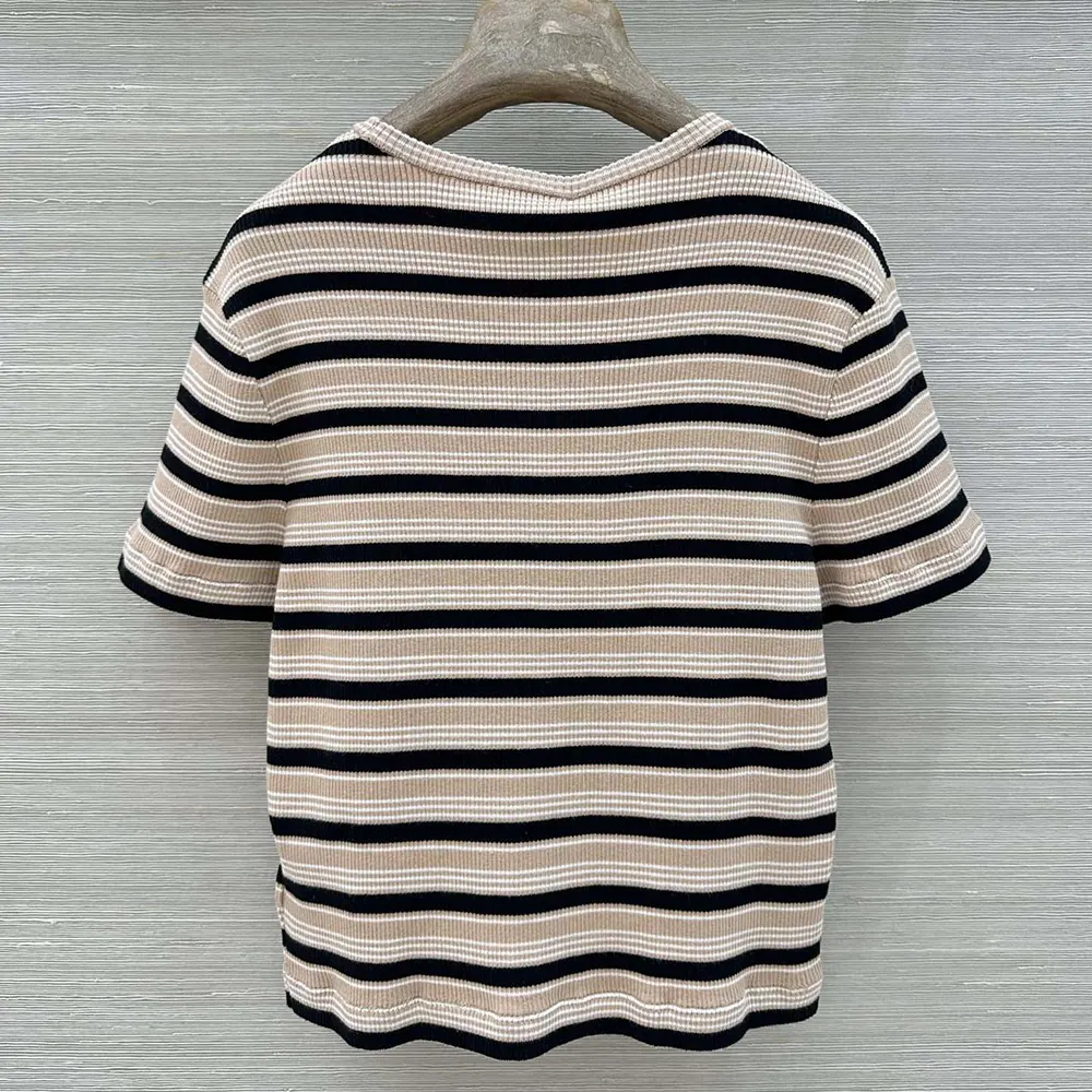 Side profile showing relaxed fit of Fendi cotton striped jumper