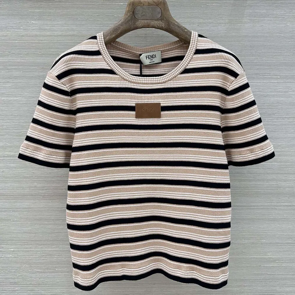 Close-up of Fendi logo embroidery on striped cotton jumper