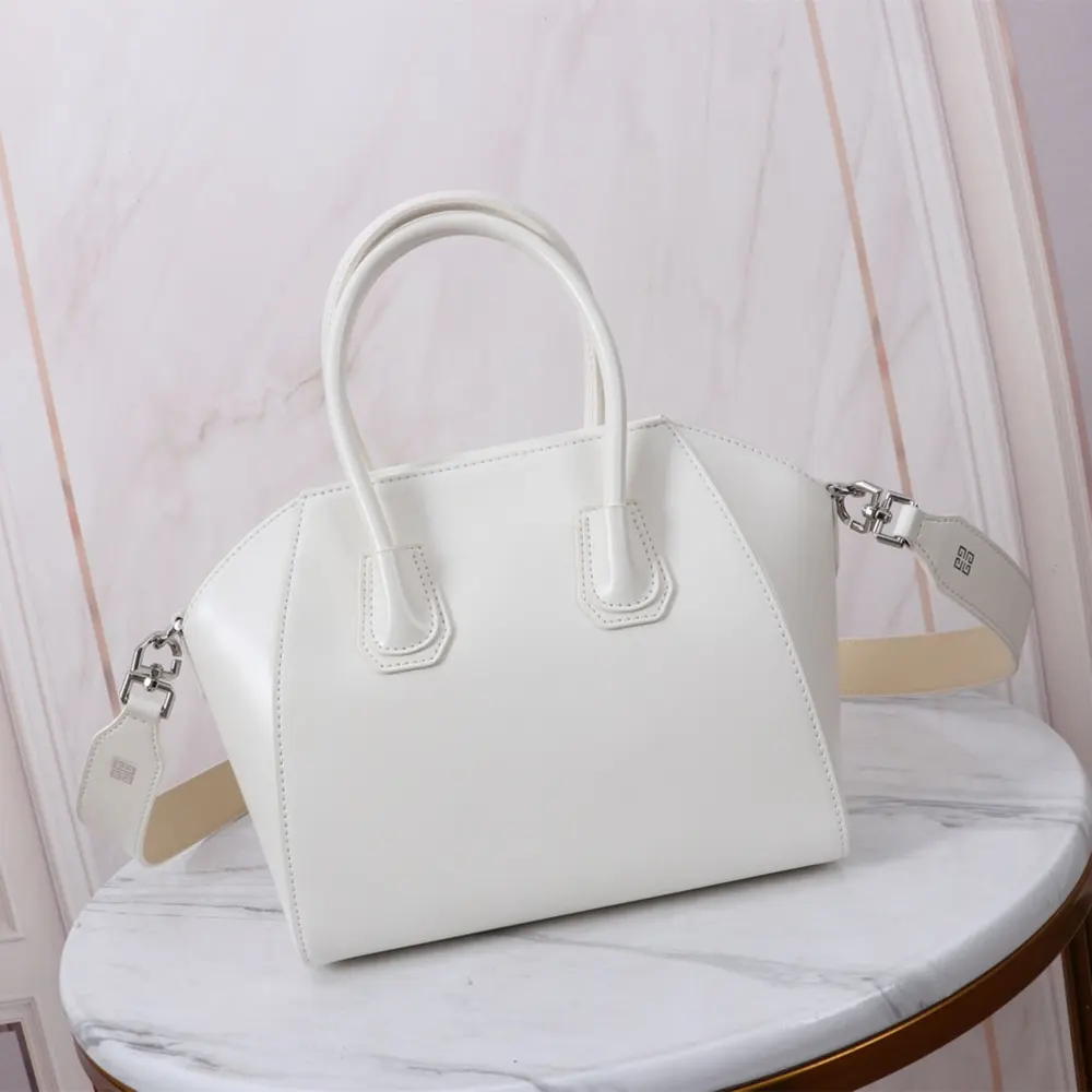 Side angle showing structured silhouette of Givenchy Women Small Antigona Bag in Box Leather-White
