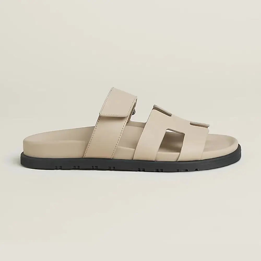 Side view of Hermes Unisex Chypre Sandal-Beige Nomade showing strap detail