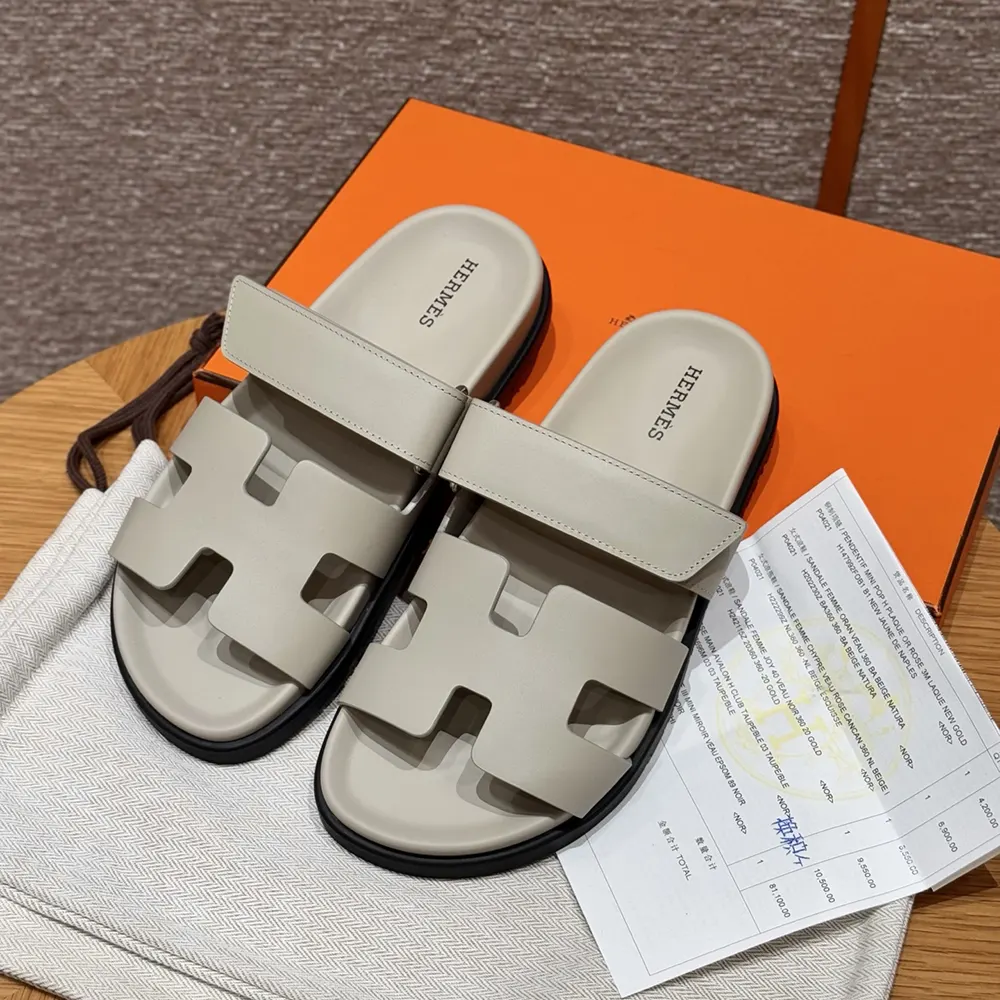 Close-up of polished buckle on Hermes Unisex Chypre Sandal-Beige Nomade